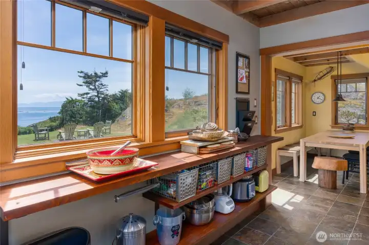 South wall in the kitchen with views to the bay and Straits. South wall in the kitchen with views to the bay and Straits.