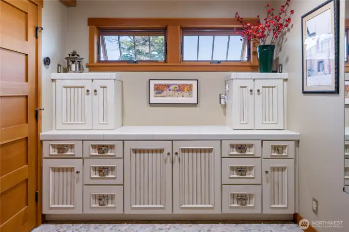 Main floor bath shares space with the laundry which is behind the fir doors on the left. Main floor bath shares space with the laundry which is behind the fir doors on the left.