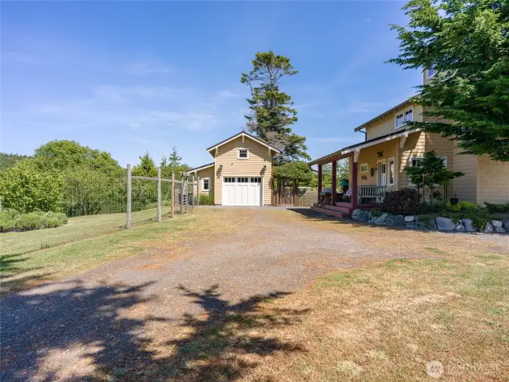Shop/garage with studio above and main house on the right. Shop/garage with studio above and main house on the right.