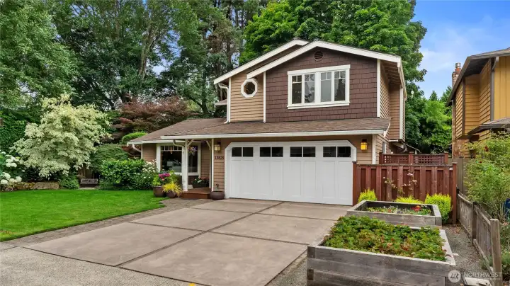 Specimin trees and plants are placed thoughfully throughout the yard. Professionally landscaped. Heavy duty lined cedar raised planting beds for your gardening pleasure. Could potentially be RV parking if beds were removed.