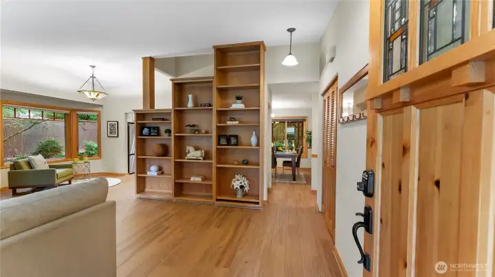 Custom touches abound as you enter. Brand new luxury plank flooring throughout the main level. Bookshelf with adjustable shelves displays all your treasures.