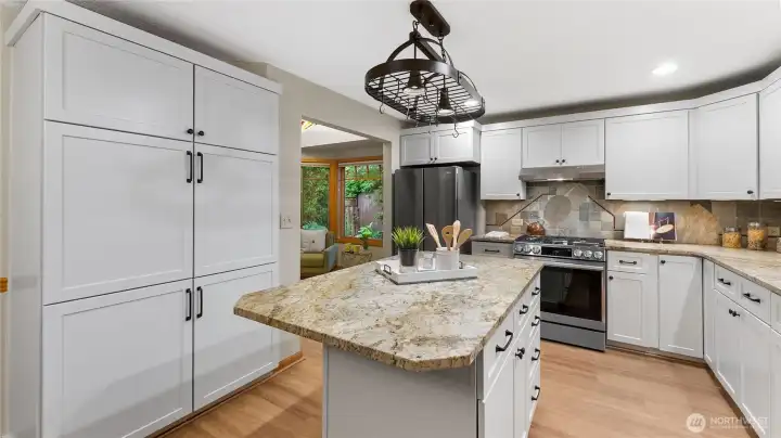 Plenty of storage/pantry cabinet space keep the kitchen organized. Shelf Genie roll outs are installed in most of the kitchen cabinets. There is also under cabinet lighting.