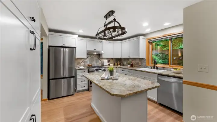 New stainless steel refrigerator and range were added in 2026. The solid wood-wrapped window views to the serene rear yard. A lazy susan cabinet is located in the corner of the kitchen.