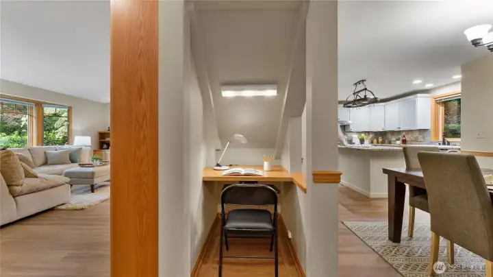 No space is wasted in this custom home. This under the stair nook is a perfect spot for home tasks.