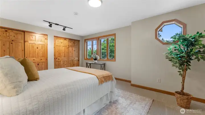 The primary bedroom is located on the second floor. The windows offer privacy shades which can be drawn up from the bottom or down from the top. Plenty of closet space for all of your belongings.