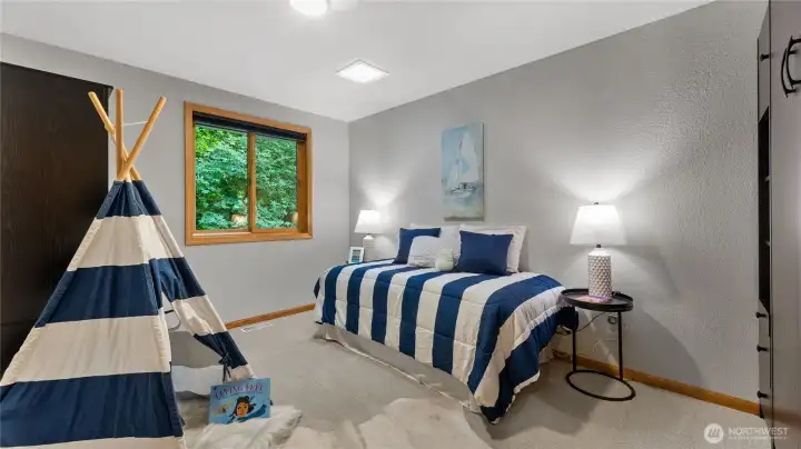 One of the other two bedrooms located on the second floor. This room also offers a Murphy bed with drawers/shelf storage.