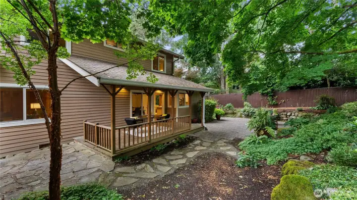 A veiw of the rear of the home and professionally landscaped rear yard.