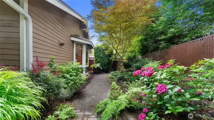 The side yard offers a gorgeous view from the sitting area bay window.