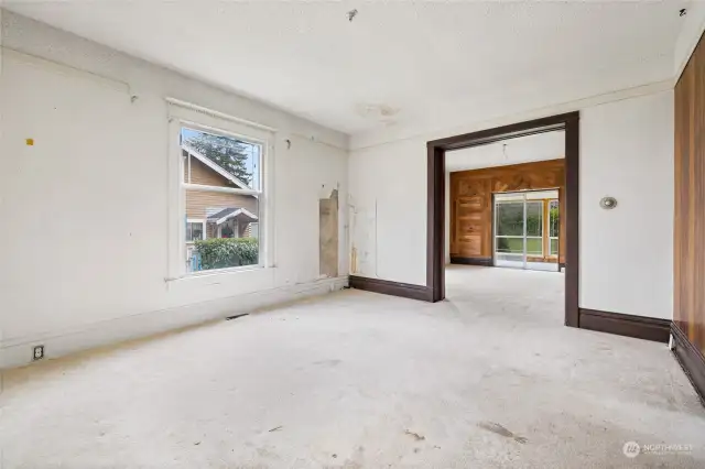 Formal living room area with wood floors throughout the main level.