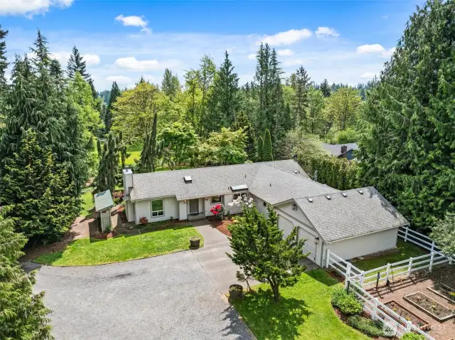 Bird's-eye view of a beautiful blend of home and nature—over 2 acres of opportunity await!