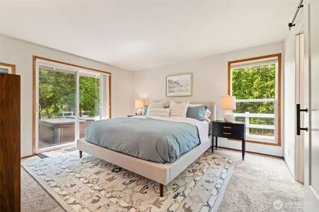 Serene primary suite with outdoor access and tons of natural light.