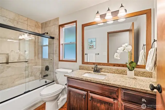 Full bathroom with updated finishes from 2020 for secondary bedrooms and guests.