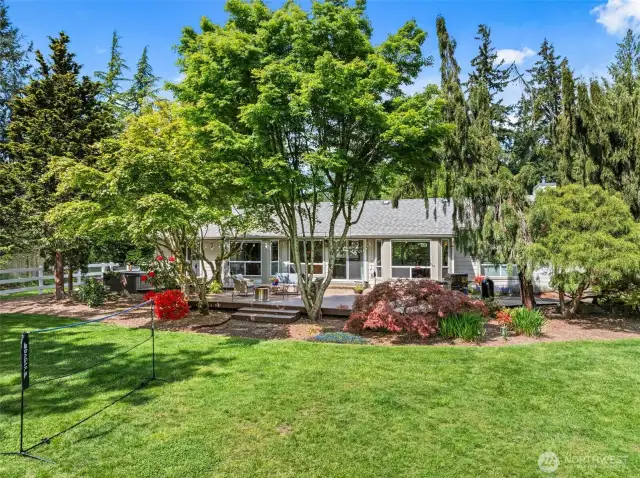 Tranquil and private—this beautifully landscaped yard is made for quiet moments and outdoor living.