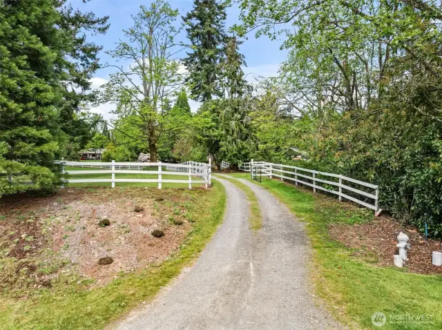 Tucked away from it all, this long driveway brings you home to tranquility and space.