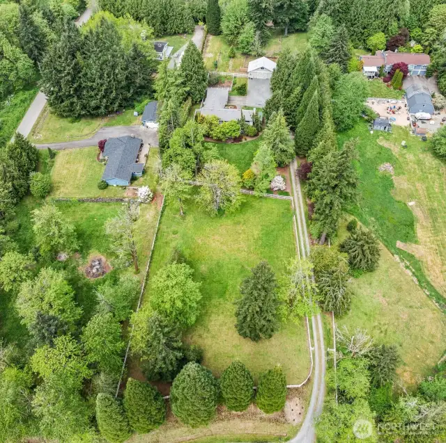 Take in the full scale of this spacious 2+ acre property—perfectly positioned for privacy and peace.