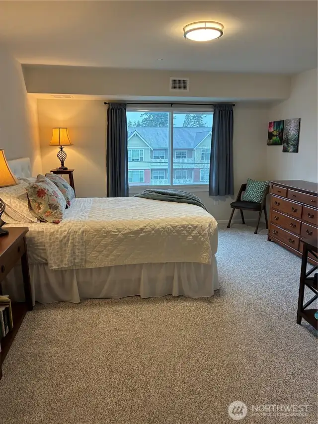 Primary bedroom has triple pane window for great sound reduction, comfy wall to wall carpet