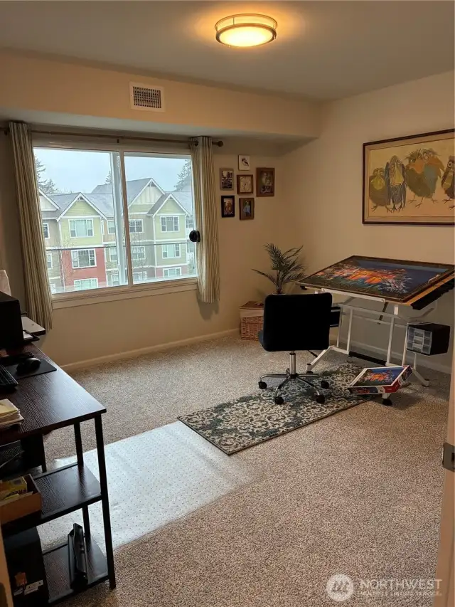 Spare bedroom is set up as hobby/office space.