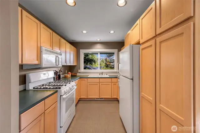 U shaped kitchen with lots of cabinet storage