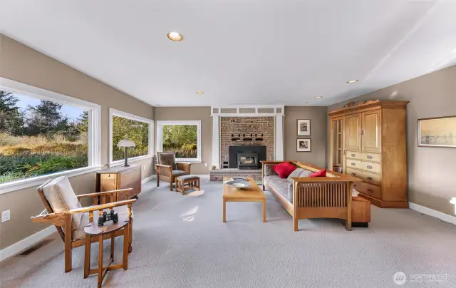 Large living room with wood burning fireplace
