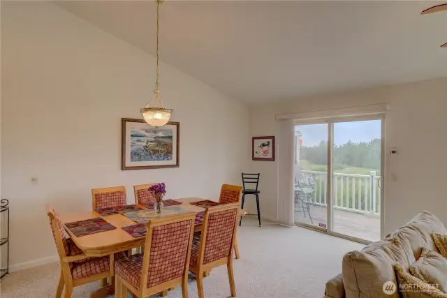 Dining room with sliding door to the north facing deck and ocean view.