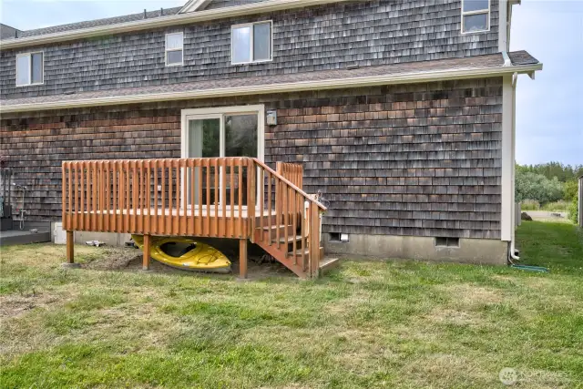 Main floor south facing deck and back yard.