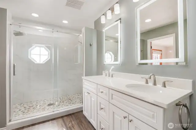 Updated shower with tile & stone accents. Quartz countertops & all new bath fixtures
