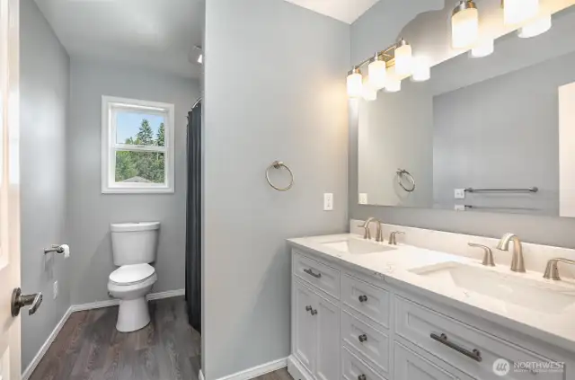 Upstairs full bath includes all new fixtures, quartz countertops & tile shower surround