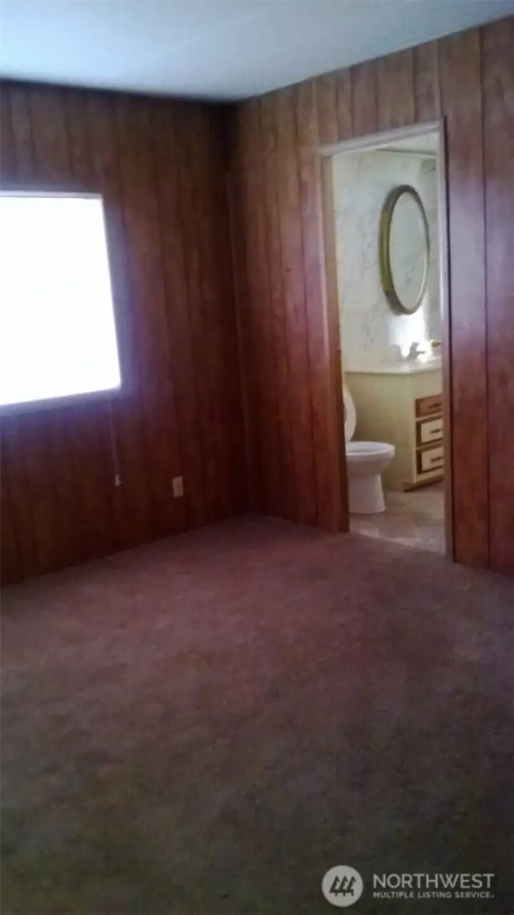 Larger bedroom with entry to bath.