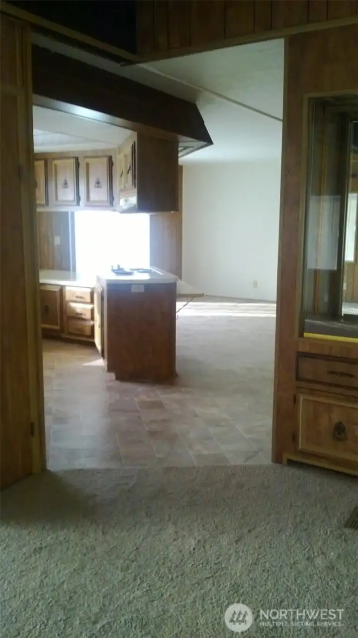 Old layout of living area towards kitchen.