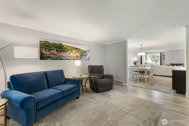 The newer vinyl plank flooring throughout the house provides a great palette for the white walls