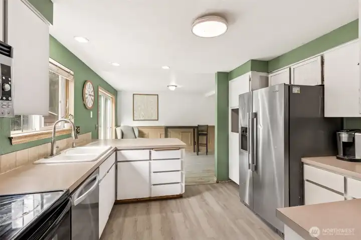 Kitchen with Stainless Steel Appliances and Eating Space