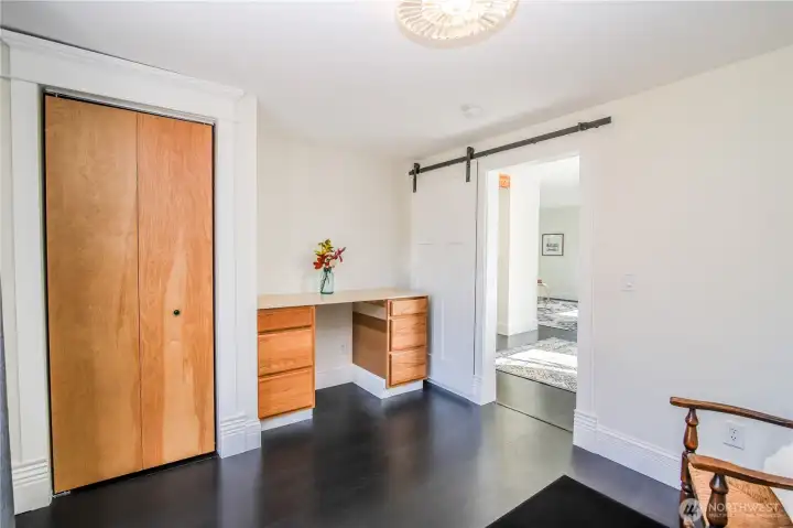 Built-in desk in bedroom and roomy closet.