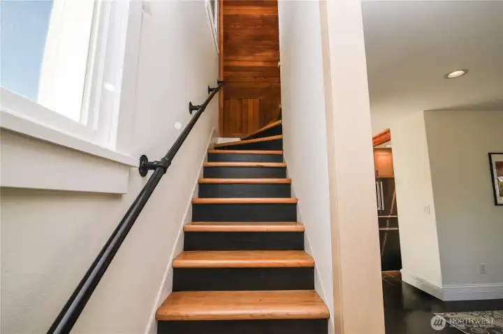 Owners hand built the stairs and railing refinished the original paneling.