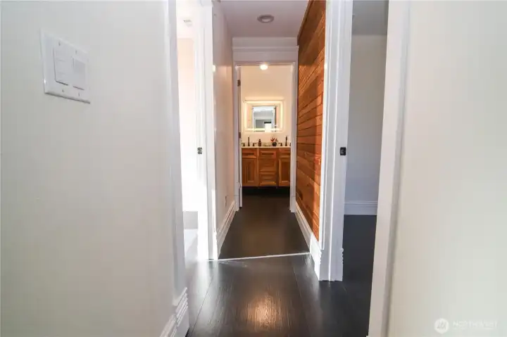 Hallway to two upstairs bedrooms and full bath.