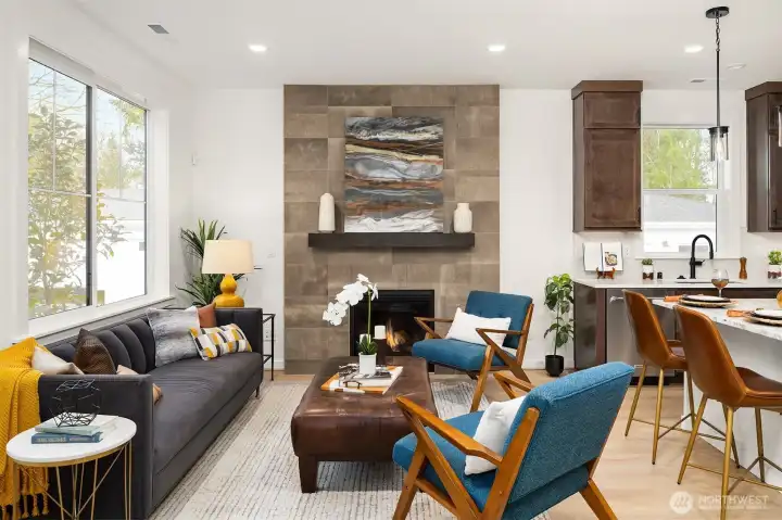 Fireplace is highlighted by 12x24 full height tile