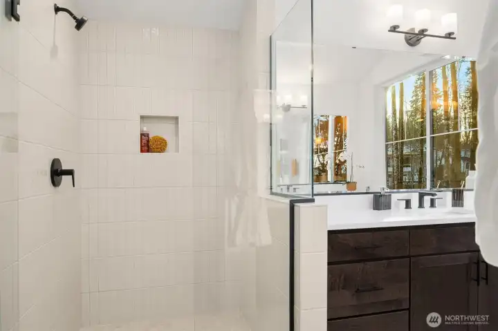 2x9 Arizona Tile highlights the beautiful shower in the primary bathroom
