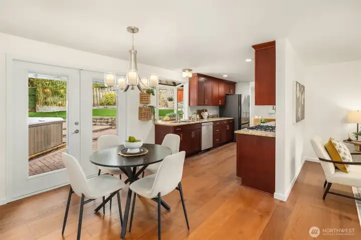 Dining nook just off the kitchen with French doors to back entertaining patio