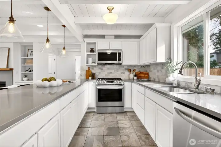 All new stainless steel appliances, quartz countertops and marble backsplash