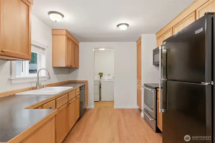 Walk through the kitchen into the laundry room