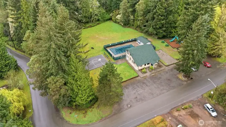 View of clubhouse across the street! Includes a pool, basketball court, and playground!