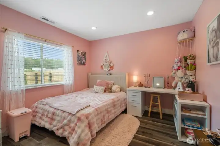 Adorable bedroom on main floor looks out to private side yard