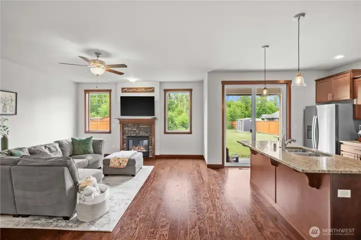 Open living space with backyard views in modern Stanwood WA family home Open living space with backyard views in modern Stanwood WA family home