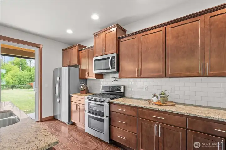Kitchen with breakfast bar and abundant storage in Stanwood WA home for sale Kitchen with breakfast bar and abundant storage in Stanwood WA home for sale