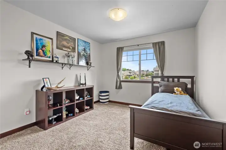 Spacious bedroom with large window in move-in ready Stanwood WA family home Spacious bedroom with large window in move-in ready Stanwood WA family home