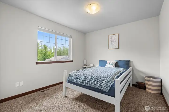 Comfortable guest bedroom with natural light in 5-bedroom Snohomish County home Comfortable guest bedroom with natural light in 5-bedroom Snohomish County home