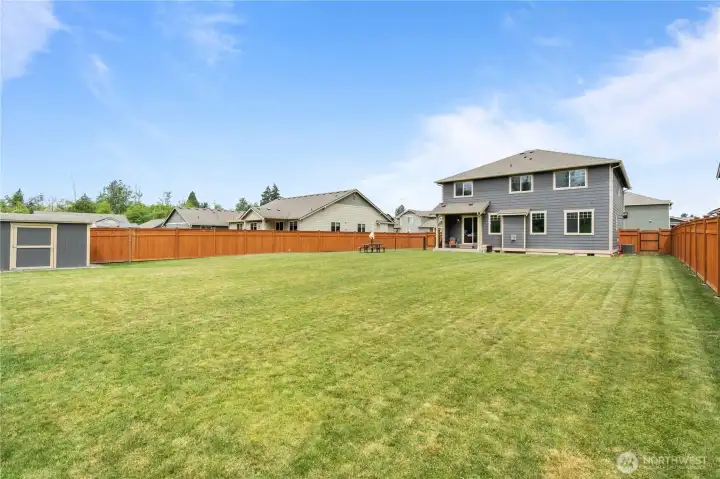Large fully fenced backyard in Stanwood WA with room for play, pets, and outdoor gatherings Large fully fenced backyard in Stanwood WA with room for play, pets, and outdoor gatherings