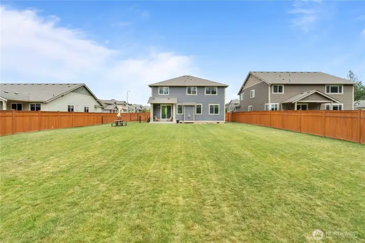 Spacious backyard ideal for entertaining, gardening, and enjoying Pacific Northwest outdoor living Spacious backyard ideal for entertaining, gardening, and enjoying Pacific Northwest outdoor living
