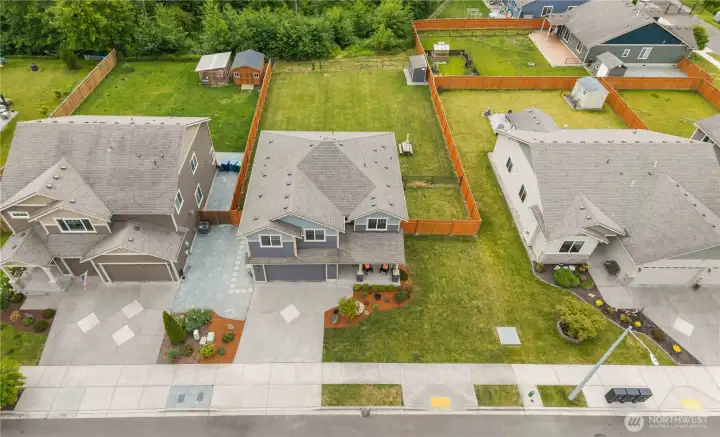 Aerial view of large lot home in Stanwood WA showcasing backyard space and neighborhood setting Aerial view of large lot home in Stanwood WA showcasing backyard space and neighborhood setting