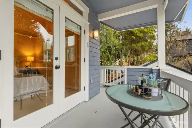 French Doors open from the Primary suite to the covered wrap around deck.