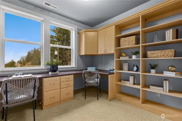 Third room on the upper level can be a bedroom or office with built in cabinets, desk and California closet. Has views of the Puget Sound.